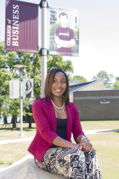 Natasha Allen_article image student profile, seated outside the Holley Academic Center