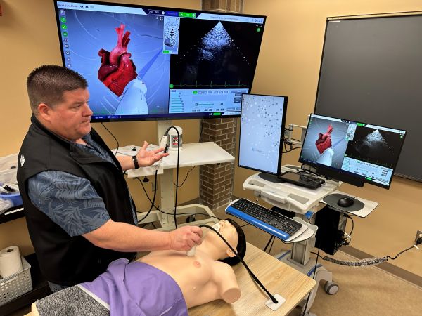 Kyle Hodgen demonstrates an ultrasound simulator