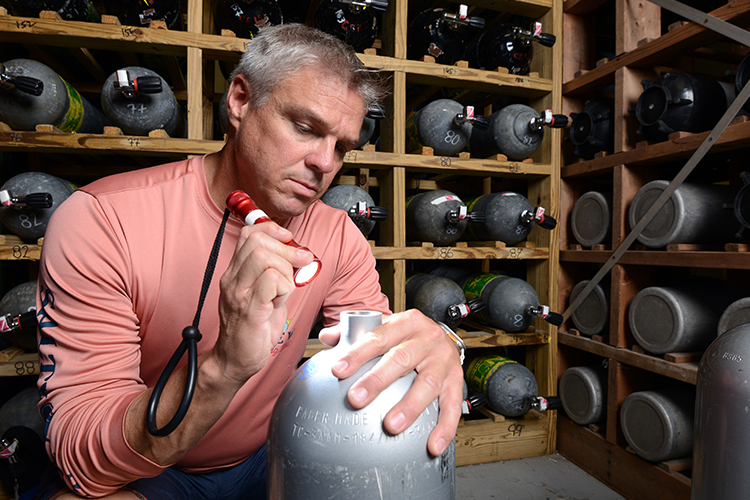 Mike Davis working on scuba tank