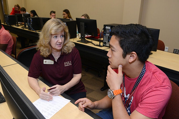 Advising staff employee talking with a student