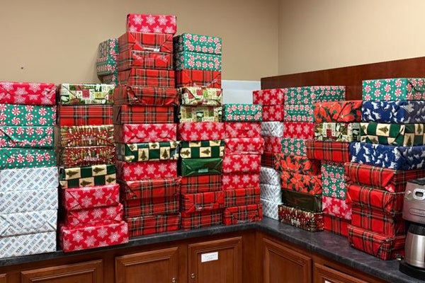 Stacked, wrapped gifts for the Clifford Chester Sims State Veterans Nursing Home