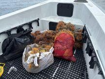 Trash recovered from the St. Andrews State Park jetties is shown in the bow of the dive program's boat.