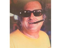 Ed Hickey Jr head shot with cigar