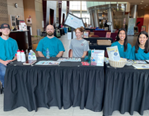 Health Fair 2023 table with participants