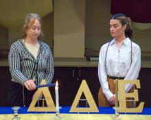 Layne and Kathryn light candles