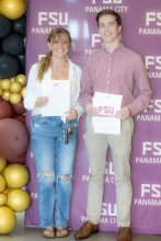 Couple in front of FSU PC banner