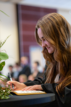 First-Year student signing book 12