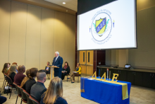 Dean Randy Hanna speaks to inductees, family and friends