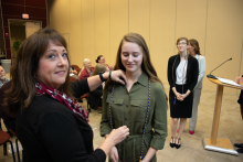 Bay County Sherriff Lt. Koren Colbert pins Vice President Cassie Compton 