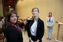 Bay County Sherriff Lt. Koren Colbert pins Treasurer Alyssa Orr