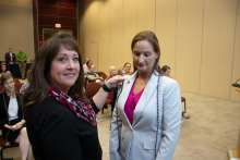 Bay County Sherriff Lt. Koren Colbert pins Secretary Chris Bennett-Bowden