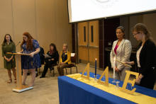 Students light DDE candles