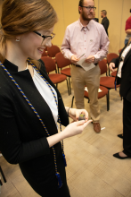 Alyssa Orr looks at her DDE pin