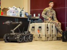 Airman, Keith Vici helps display explosive ordinance disposal