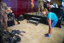 Student examines bomb robot