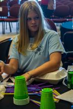 Group table activity, each group receives a plastic bag with the same items to build a raft. Groups are challenged to be able to place at least 50 pennies on the float before it sinks. Participants are encouraged to test their designs, regroup, retest, all a process of engineering.