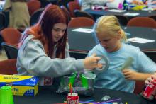 Group table activity, each group receives a plastic bag with the same items to build a raft. Groups are challenged to be able to place at least 50 pennies on the float before it sinks. Participants are encouraged to test their designs, regroup, retest, all a process of engineering.