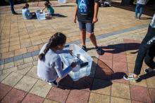 Group table activity, each group receives a plastic bag with the same items to build a raft. Groups are challenged to be able to place at least 50 pennies on the float before it sinks. Participants are encouraged to test their designs, regroup, retest, all a process of engineering.