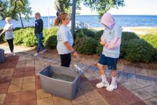 Group table activity, each group receives a plastic bag with the same items to build a raft. Groups are challenged to be able to place at least 50 pennies on the float before it sinks. Participants are encouraged to test their designs, regroup, retest, all a process of engineering.