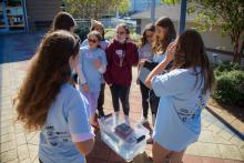 Group table activity, each group receives a plastic bag with the same items to build a raft. Groups are challenged to be able to place at least 50 pennies on the float before it sinks. Participants are encouraged to test their designs, regroup, retest, all a process of engineering.