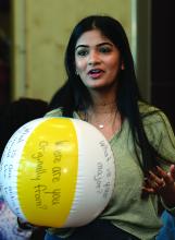 Students participate in a beach ball icebreaker game during new student orientation