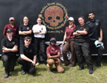 CSI students in front of CSI field trailer