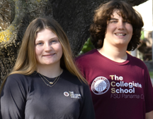 Two student smiling wearing school colors