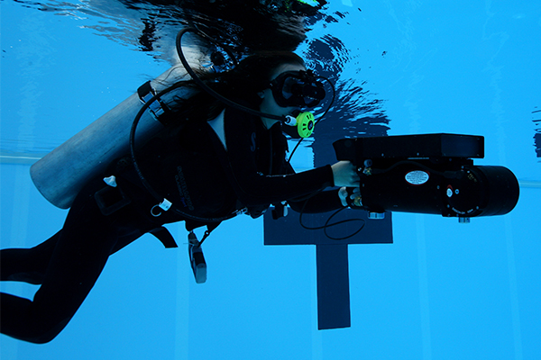 Scuba diver with camera underwater