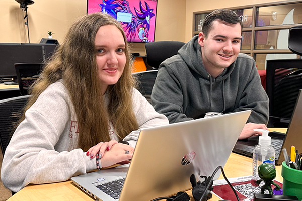 two studenets smiling