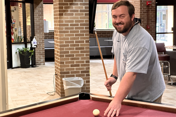 students playing pool
