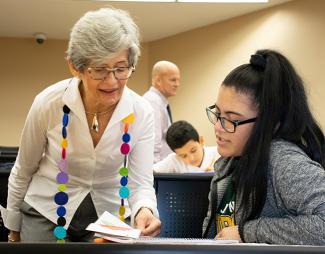 Lulu Delacre and studentIn celebration of National Hispanic Heritage Month FSU Panama City spotlighted its commitment to diversity and inclusion as core institutional values with a lecture from bilingual author, speaker and artist of children’s books Lulu Delacre.  Delacre was born in Puerto Rico of Argentinian parents. She has been drawing since she was five years old and attended L’Ecole Supérieure d’Arts Graphiques, in Paris, France.  “I dreamed of creating books inspired by my heritage, books that celeb