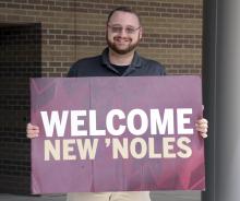 CEE graduate Marshall Sowell greets incoming Noles