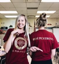 Staff displays #fsupcstrong tagline on t-shirts