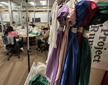 Students in Project Runway sew costumes.