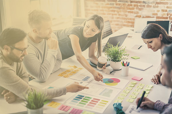 professionals brainstorming at conference table