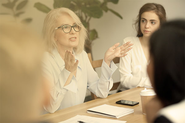 woman leading meeting in conference room