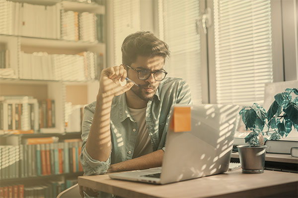 man studying at computer