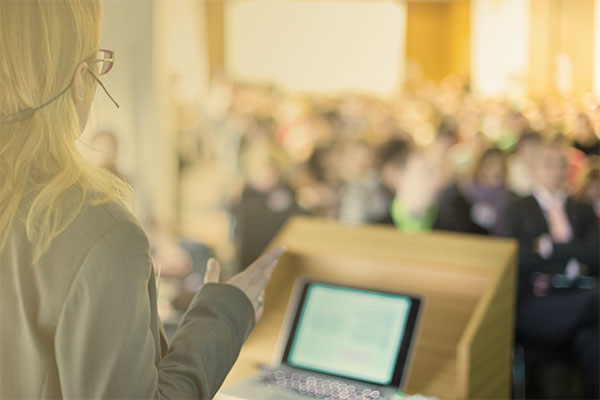 conference presenter in front of audience