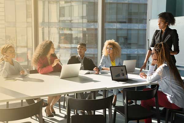 Image of people talking in a conference room 