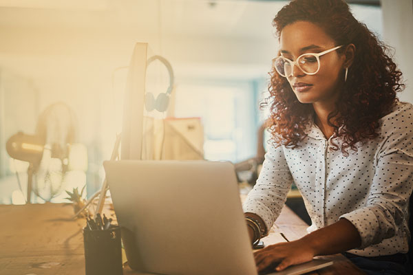 Image of woman looking at computer.
